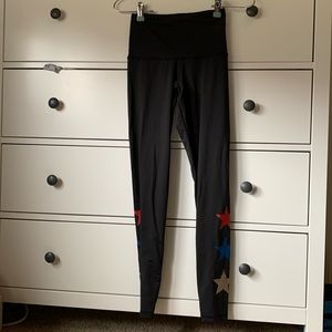 Black leggings from free people website XS size with stars on lower leg